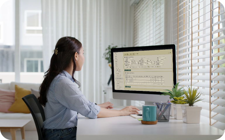 Woman using ChartCaddy on desktop