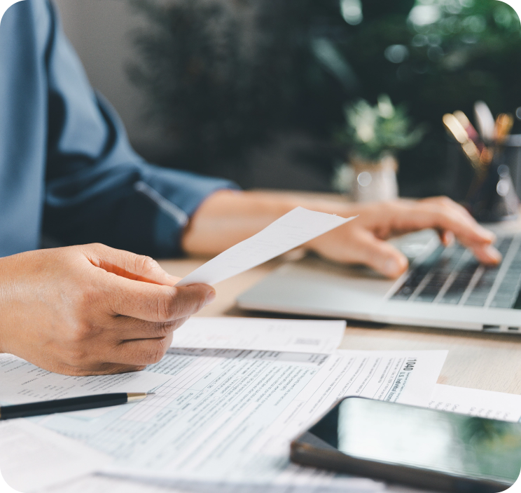Person inputting documents into computer